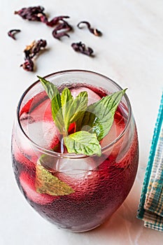 Cold Brew Hibiscus Tea with ice and Mint Leaves.