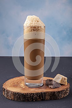 Cold brew or Nitro Coffee drink in the glass with bubble foam. Cold coffee