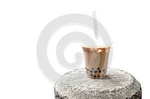 Cold bubble pearl milk tra famous beverage in Taiwan on rock photo