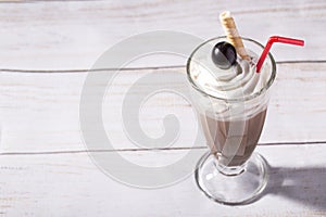 Cold caffe frappe on wooden background