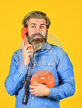 Cold Calling Scripts. Outdated technology. Manager phone dialog communication. Answering machine. Bearded hipster man