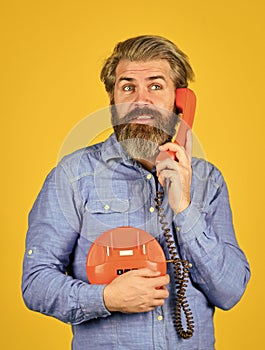 Cold Calling Scripts. Outdated technology. Manager phone dialog communication. Answering machine. Bearded hipster man