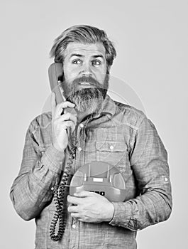 Cold Calling Scripts. Outdated technology. Manager phone dialog communication. Answering machine. Bearded hipster man