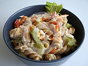 Cold chicken pasta salad in a grey bowl