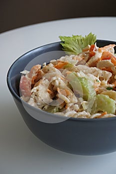 Cold chicken pasta salad in a grey bowl photo