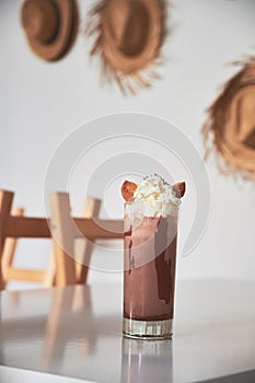 Cold chocolate milkshake frappe in glass