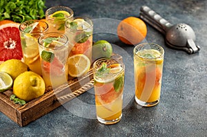 Cold citrus fruit drinks lemonade ice mint leaves