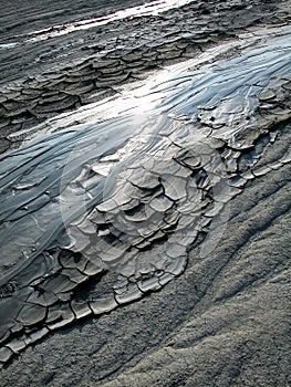 Cold clayey mud mixed with hydrocarbons, flows down from a mud volcano in the natural reserve of Salse of Nirano.