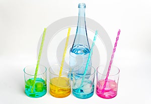 Cold, clean water in rainbow colored glasses