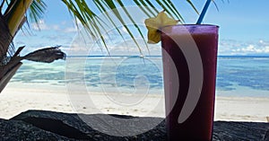 cold cocktail at a tropical beach photo