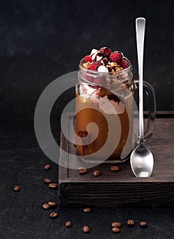 Cold coffee with chocolate ice cream and raspberries