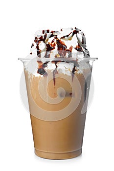 Cold coffee covered with whipped cream and chocolate in plastic cup on white background