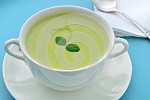 Cold creamy green pea soup. Summer meal.
