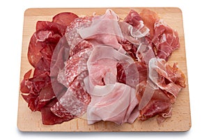 Cold cuts on wooden cutting board,