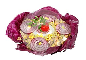 Cold dish decorated with purple onion and cabbage