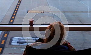 Cold drink condensing on airport terminal window