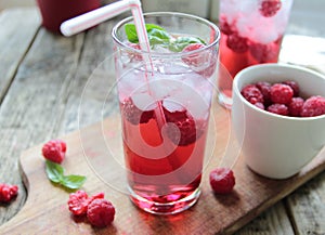 Cold drink with fresh rasberries fruits