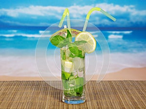 Cold drink with lemon slice and spearmint