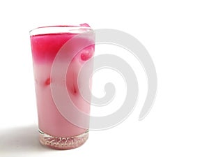 cold drink. a mixture of milk, soda and strawberry flavored syrup photo