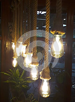 Cold-electric bulbs on a knitted string in retro style like luminaries photo