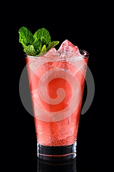 Cold fizz cocktail with strawberry isolated on black