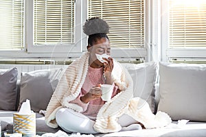 Cold And Flu. Portrait Of Ill African American Woman Caught Cold, Feeling Sick And Sneezing In Paper Wipe. Closeup Of Beautiful