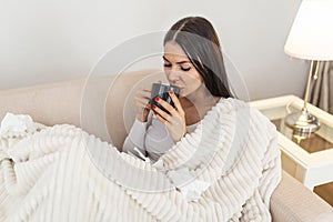 Cold And Flu. Portrait Of Ill Woman Caught Cold, Feeling Sick And drinking hot bevarage. Closeup Of Beautiful Unhealthy Girl