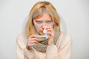 Cold and flu remedies. High temperature concept. Take temperature and assess symptoms. Measure temperature. Woman feels