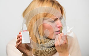 Cold and flu remedies. Runny nose and other symptoms of cold. Nasal drops bottle. Nasal spray runny nose remedy. Woman