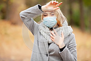 Cold and flu. Woman with a medical face mask at outdoor