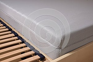 Cold foam mattress on slatted frame