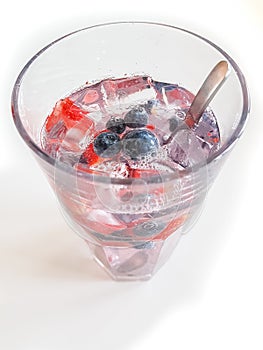 Cold fresh drink with fruits and ice. Summer refreshment. Water in glass.