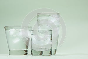 Cold fresh drinking water in glass on table.