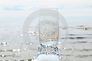 Cold frothy drink in the heat on the beach