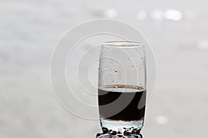 Cold frothy drink in the heat on the beach