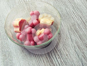 Cold frozen yogurt dog treats in a bowl on a hot summer day