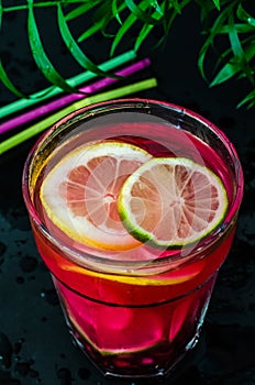 Cold fruit cocktail with garnet seeds and slices of citruses