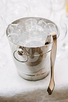 Cold ice in a bucket. Ice Bucket with tranparent cubes of ice