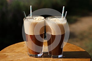 Cold ice coffee with paper straws