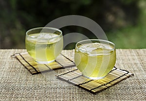 Cold Japanese green tea placed in a place with a view of the garden