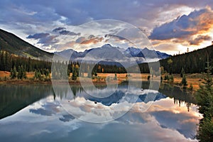 The cold lake, forest and snow mountains in Canada