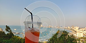 Cold lemon tea with pattaya beach view