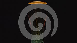 Cold light beer in a glass with water drops. Rotation 360 degrees