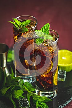 Cold Longdrink Cuba Libre in highball glass with water drops