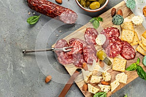 cold meats platter with Salami, sliced sausage, cheese olives. Restaurant menu, dieting, cookbook recipe top view