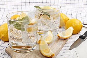 Cold mineral water with lemon as a refreshing drink