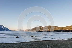 Cold morning landscape of frozen Little Shuswap Lake British Columbia Canada