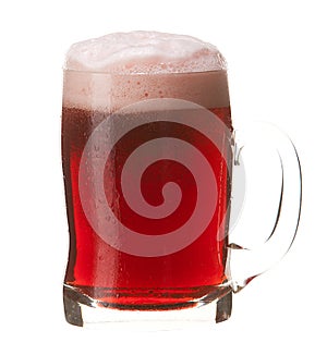 Cold mug of red beer with foam isolated on white background.