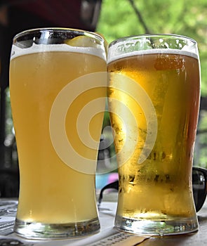 Cold nonfiltered beer, cold light beer costs on a heat and sweats, the sweating glass with beer, beer on a heat, beer,