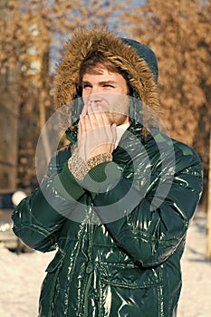 It is cold outside. Forest in snow. Fresh air. Snowy weather. Trendy winter coat. man on winter holidays. Vacation and